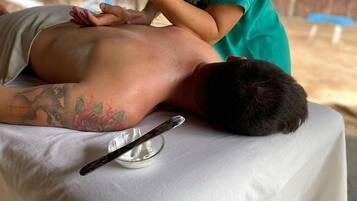 Guests can enjoy a rejuvenating outdoor massage in a serene natural setting.