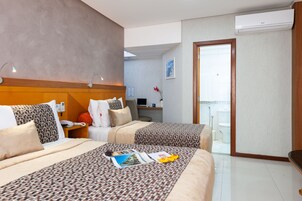 Superior Triple Room | Minibar, in-room safe, desk, laptop workspace
