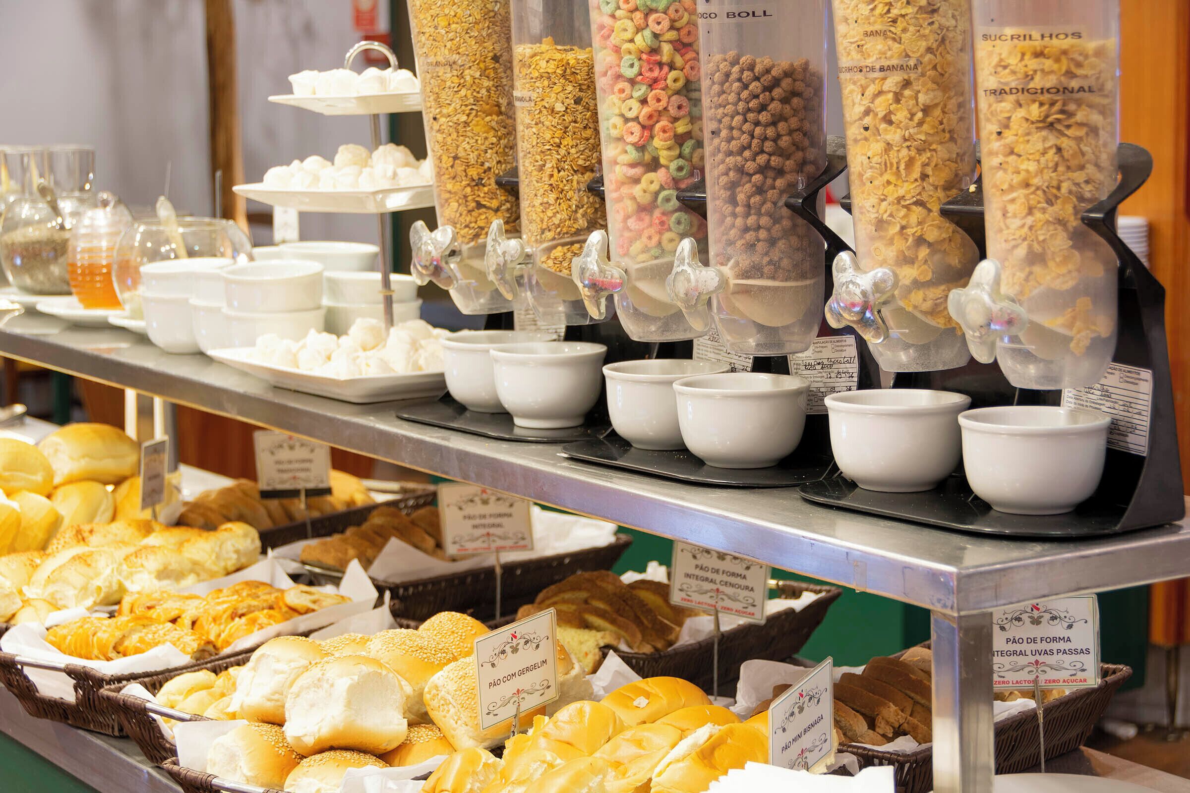 A breakfast buffet with various food items and containers.