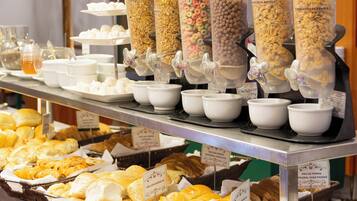 A breakfast buffet with various food items and containers.
