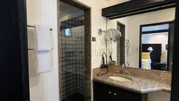 Suite, 1 King Bed | Bathroom | Shower, rainfall showerhead, free toiletries, hair dryer