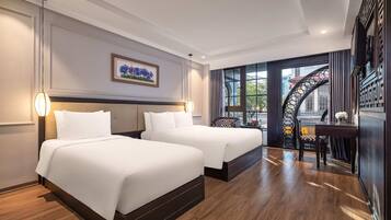 Family Triple Room | Down duvets, minibar, in-room safe, desk