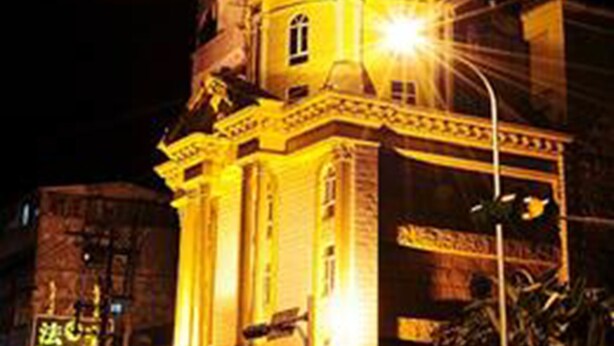 A hotel with a prominent dome and illuminated signage. - The We Hotel (Taipei)