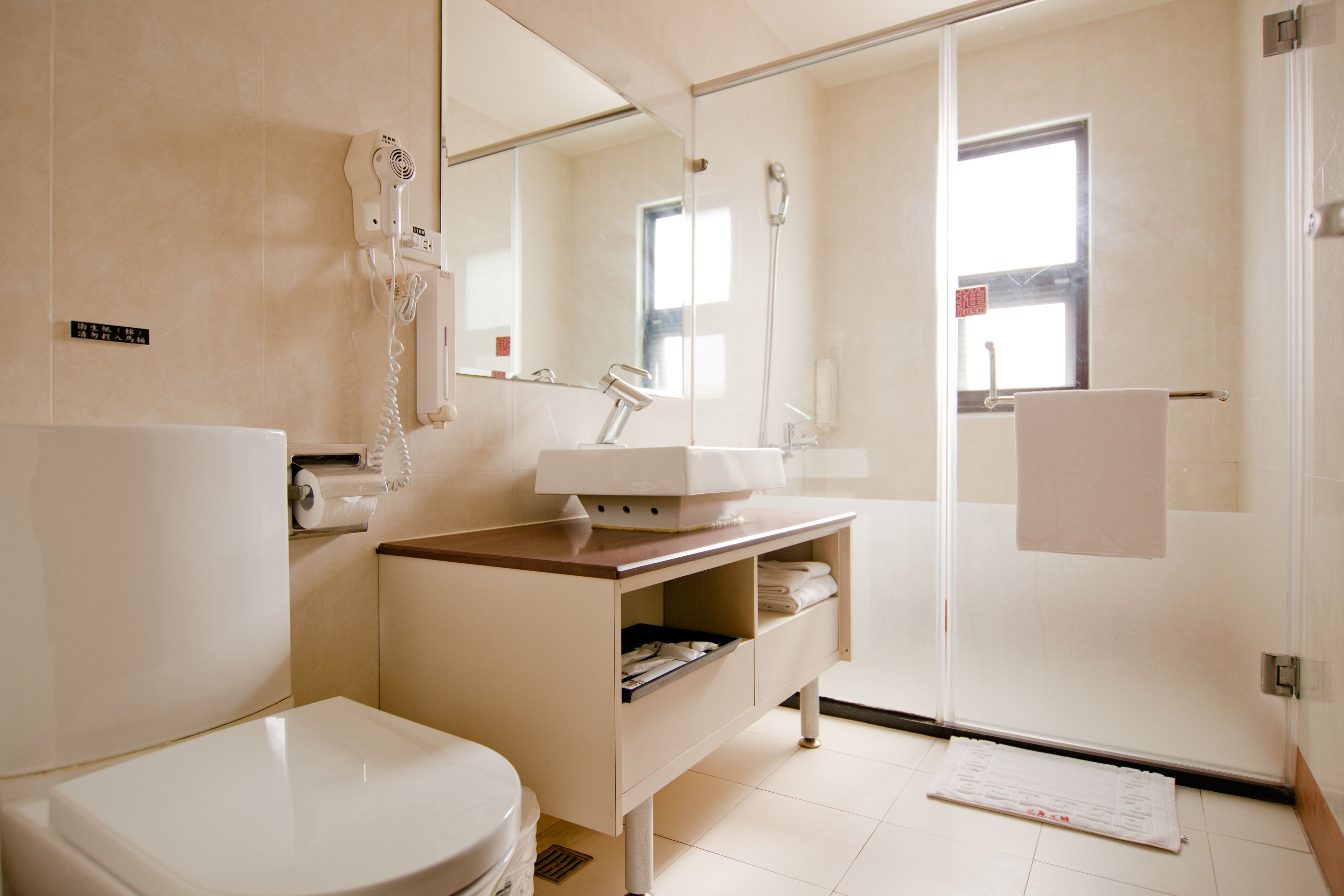 standard double room | bathroom | shower, hair dryer, slippers, towels