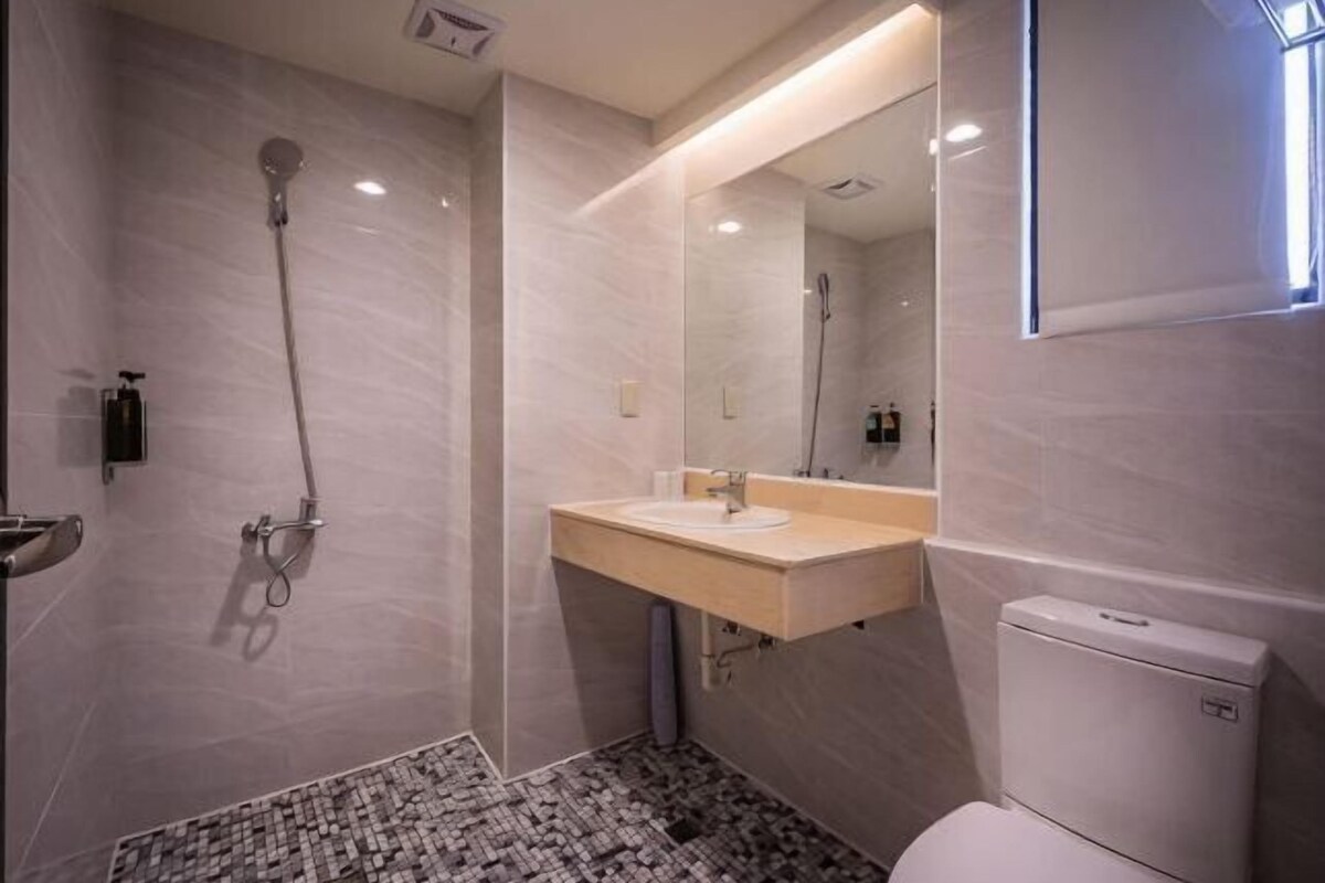 Hair dryer, slippers, towels, shampoo
