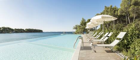 Indoor pool, seasonal outdoor pool, pool umbrellas, sun loungers