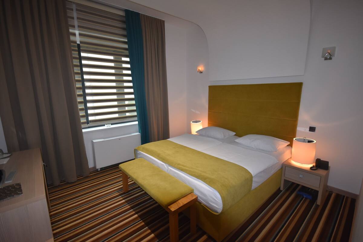 Double Room | Minibar, in-room safe, soundproofing, iron/ironing board (on request)