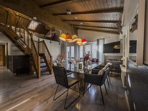 Design Apartment, 3 Bedrooms, Mountain View | Living area | 42-inch flat-screen TV with digital channels, TV, fireplace - Haus Venus (Zermatt)