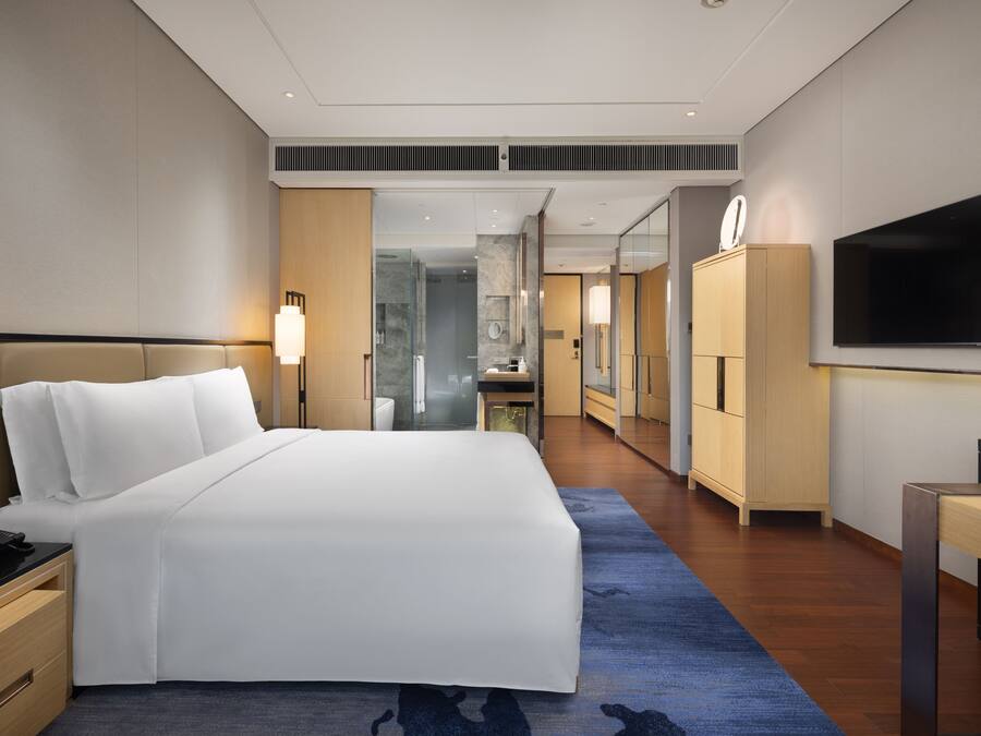 Premium bedding, down comforters, pillowtop beds, in-room safe