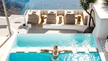 Indoor pool, pool umbrellas, pool loungers