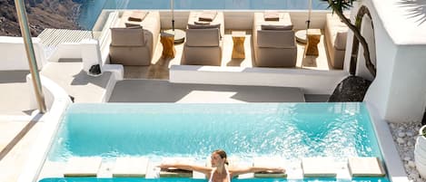 Indoor pool, pool umbrellas, sun loungers