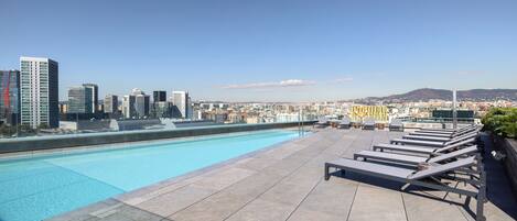 Outdoor pool, open 9:00 AM to 9:00 PM, sun loungers