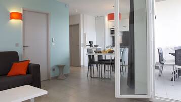 Superior Apartment, 1 Bedroom, Sea View | Living area | 72-cm flat-screen TV with satellite channels, TV