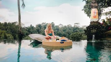 Breakfast, lunch, dinner served; Indonesian cuisine, pool views