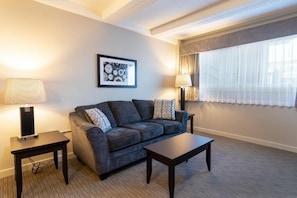 Business Studio Suite, 1 King Bed | Living area | TV