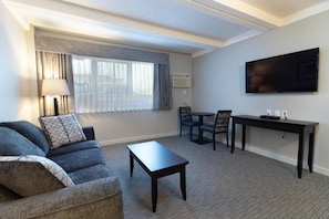 Business Studio Suite, 1 King Bed | Living area | TV