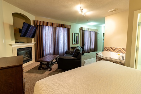 Superior Suite, 1 King Bed, Jetted Tub | Living area. BCMInns Lac La Biche