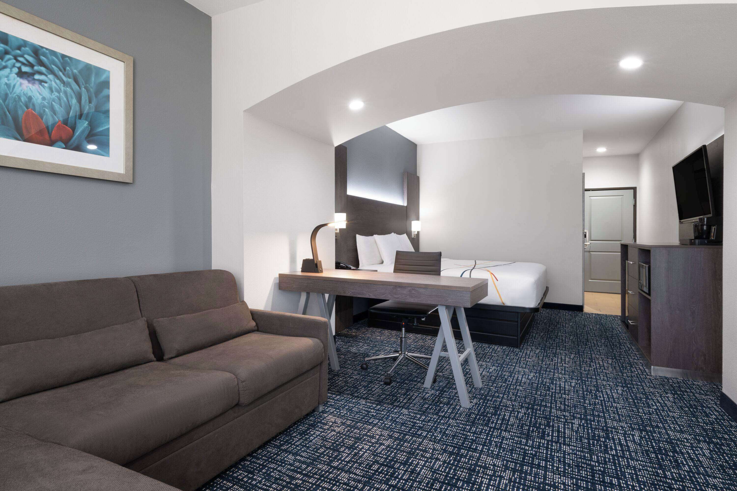 deluxe suite, 1 king bed with sofa bed, non smoking | premium bedding, desk, iron/ironing board, free cots/infant beds