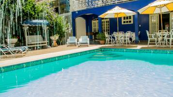 Outdoor pool, open 9 AM to 7 PM, pool umbrellas, pool loungers