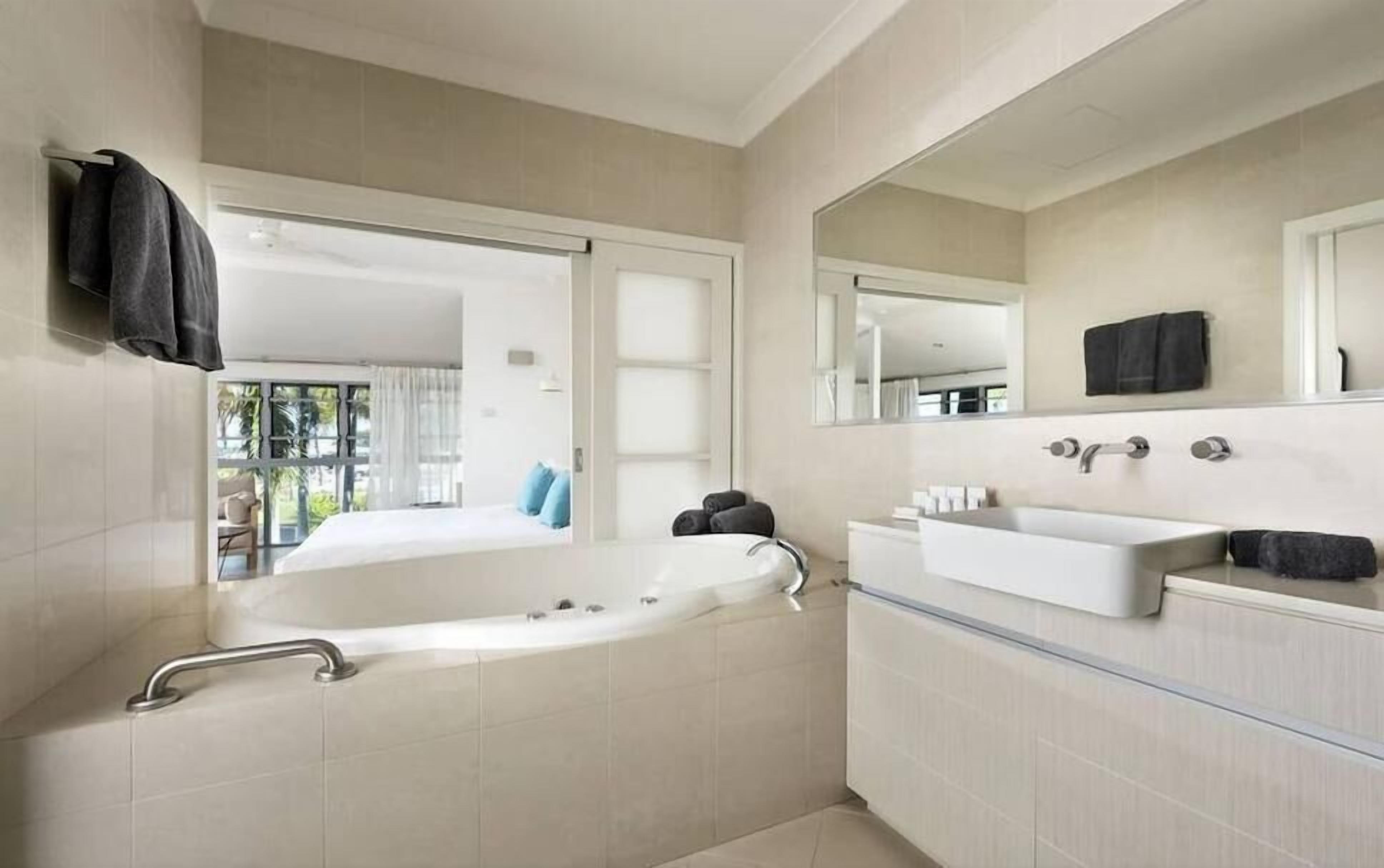 bayside premier suite | bathroom | designer toiletries, hair dryer, towels, soap