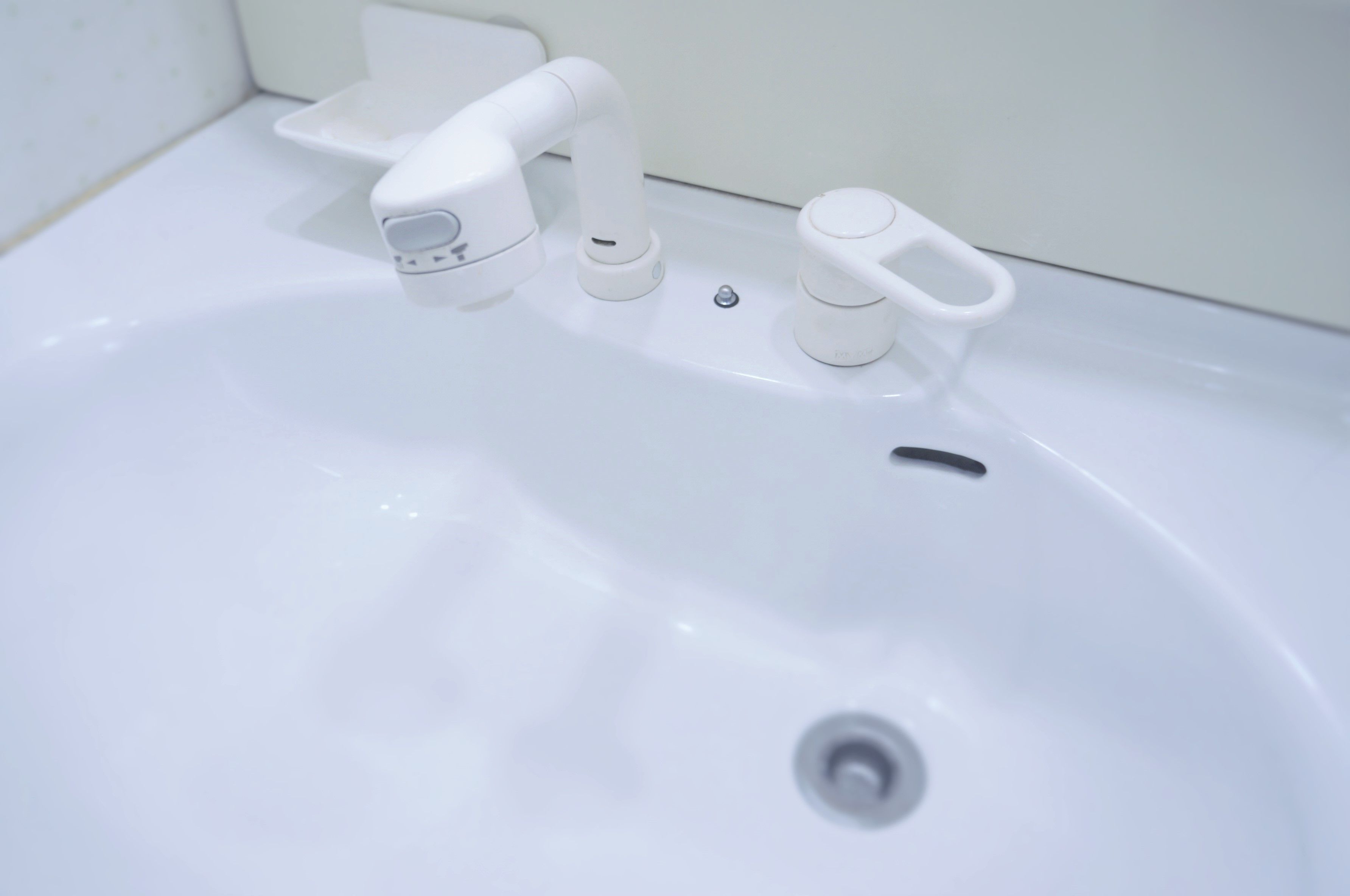 Shower, hair dryer, slippers, towels