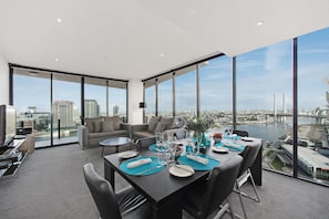 Deluxe Three Bedroom Apartment - Harbour View | Living area | 32-inch LCD TV with cable channels, TV, DVD player - Docklands Private Collection of Apartments - NewQuay (Docklands)