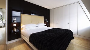 A modern bedroom with a bed, bedside tables, a nightstand, a wardrobe, and a skylight. - No.5 Maddox Street (London)