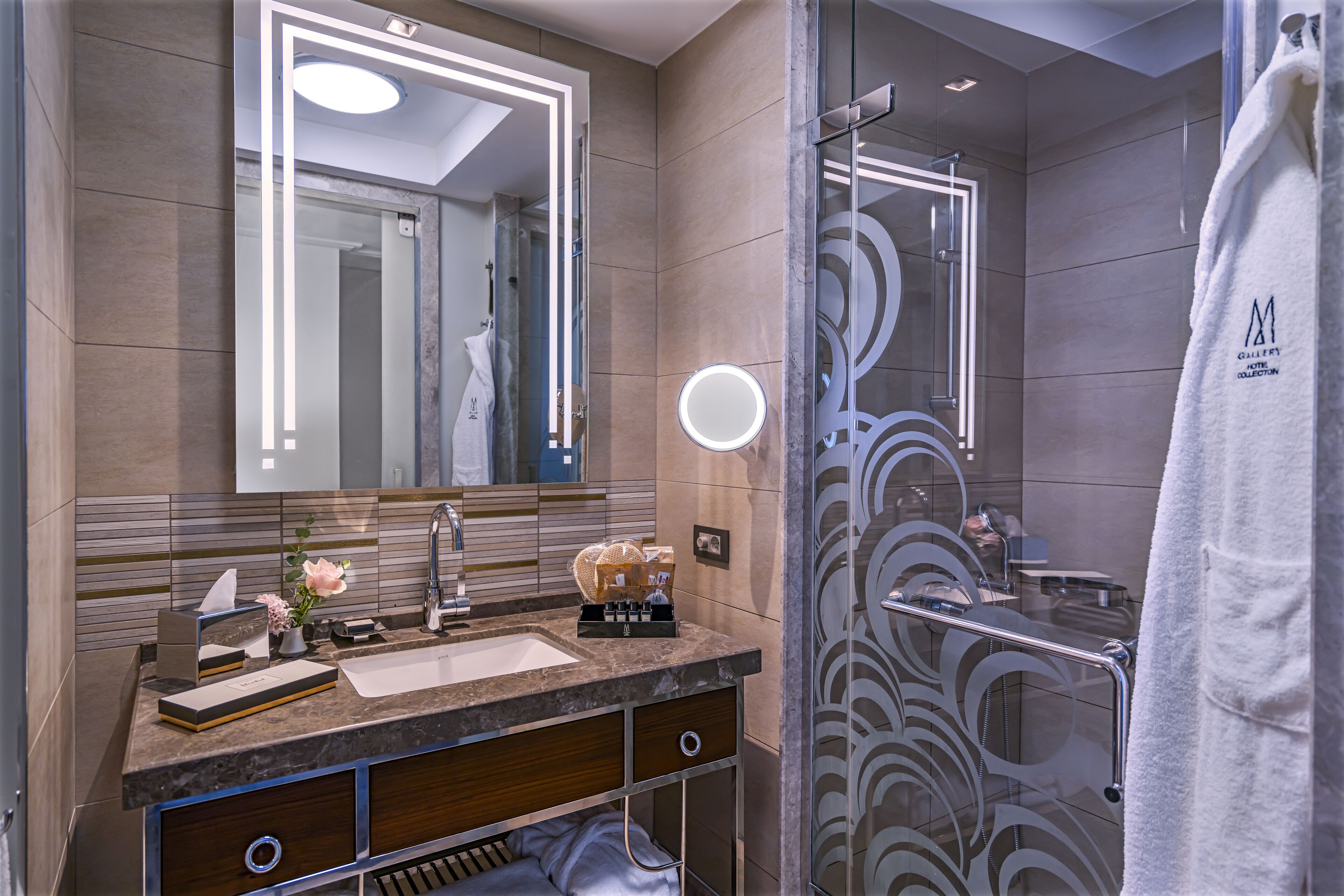 designer toiletries, hair dryer, bathrobes, slippers