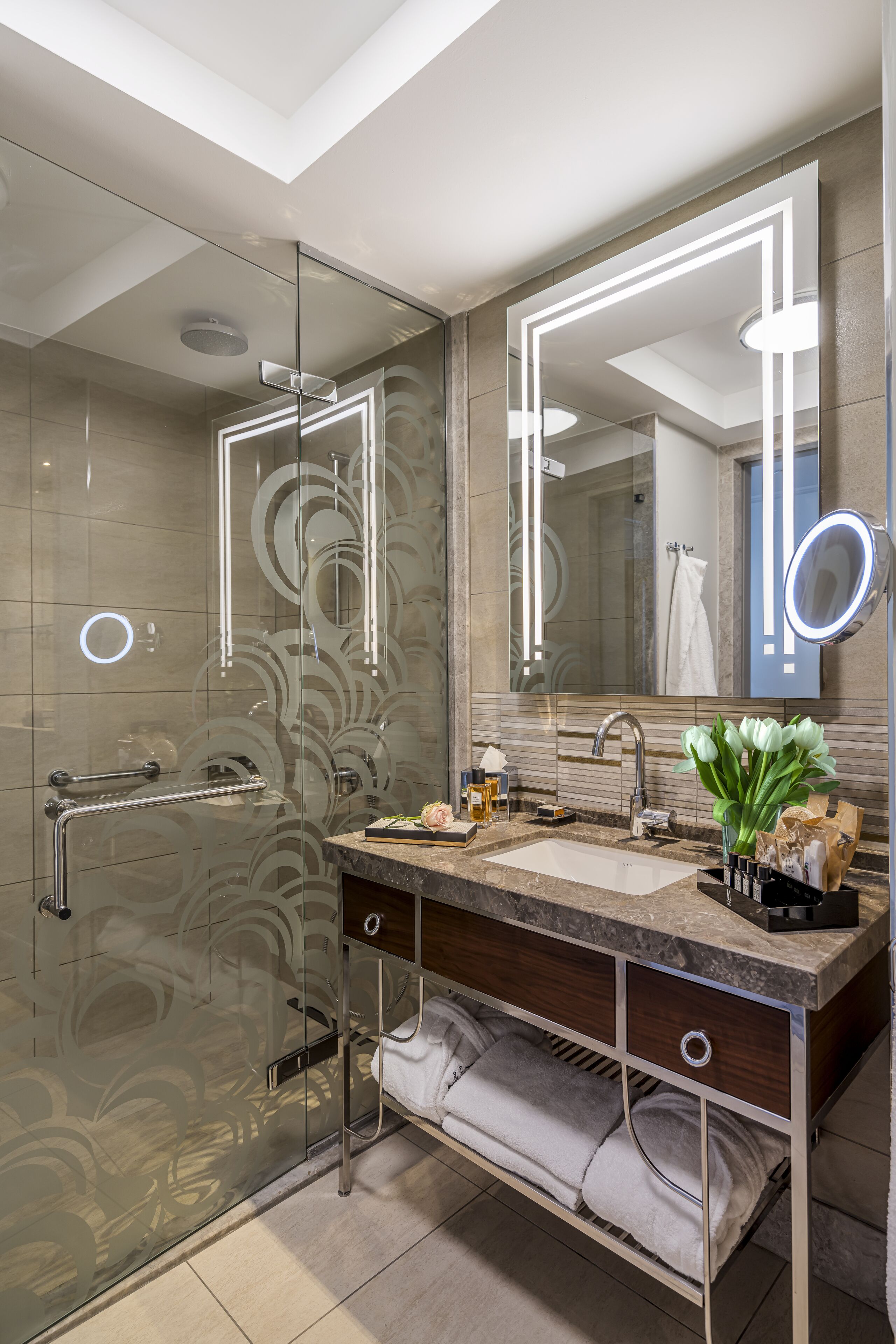 designer toiletries, hair dryer, bathrobes, slippers