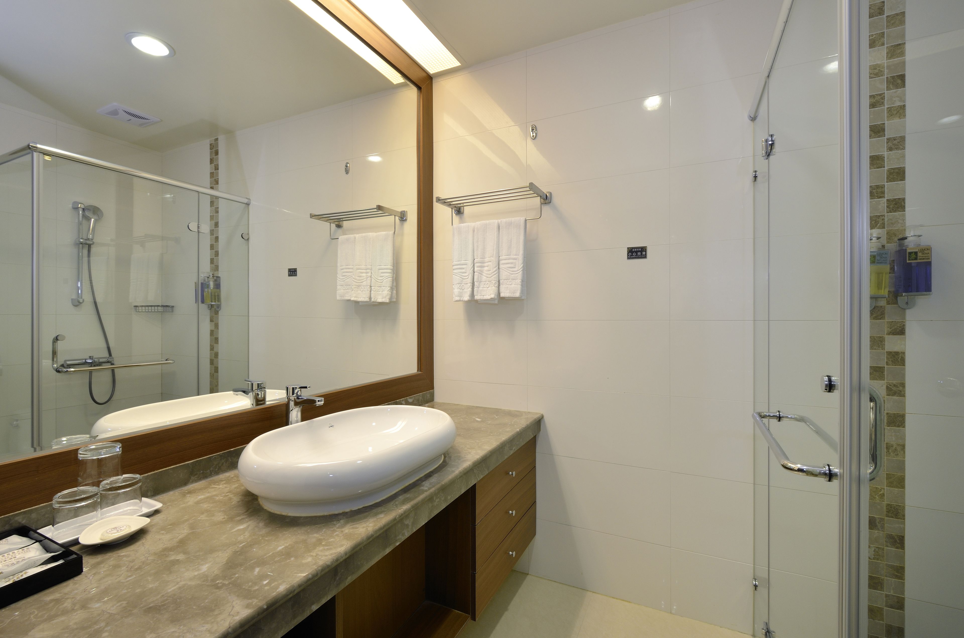 deluxe family room  | bathroom | shower, free toiletries, hair dryer, slippers