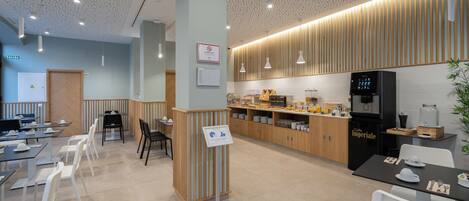 A modern cafe with wooden accents, a coffee machine, and a water dispenser.
