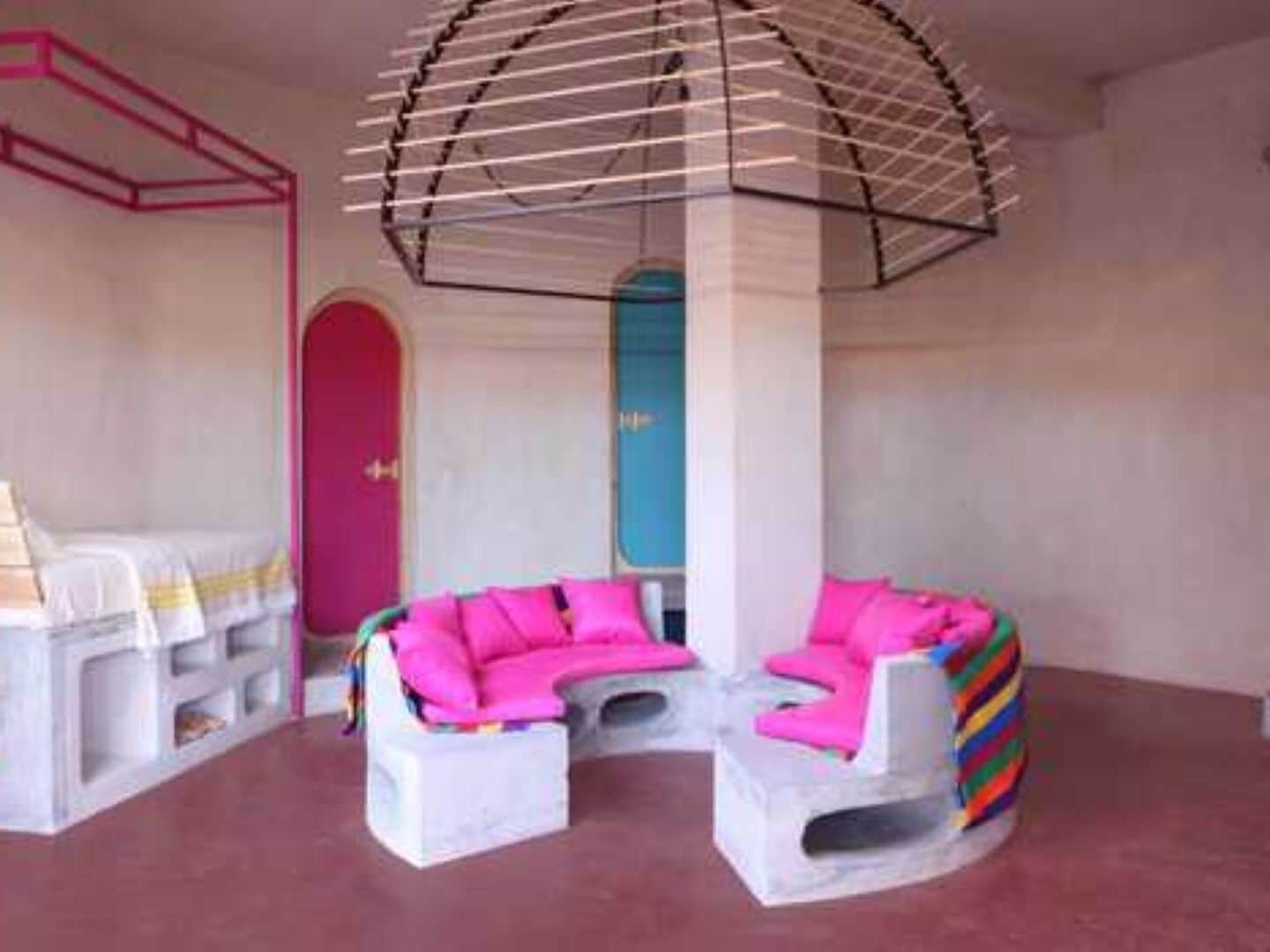 A modern interior with a unique seating arrangement and a distinctive ceiling design.
