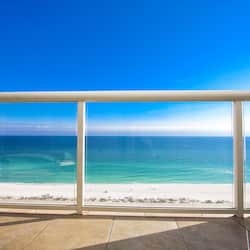 On the beach, white sand, sun loungers, beach umbrellas