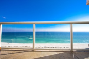 On the beach, white sand, sun loungers, beach umbrellas
