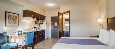 Standard Single Room, 1 Queen Bed, Kitchenette | Laptop workspace, blackout drapes, iron/ironing board, free WiFi