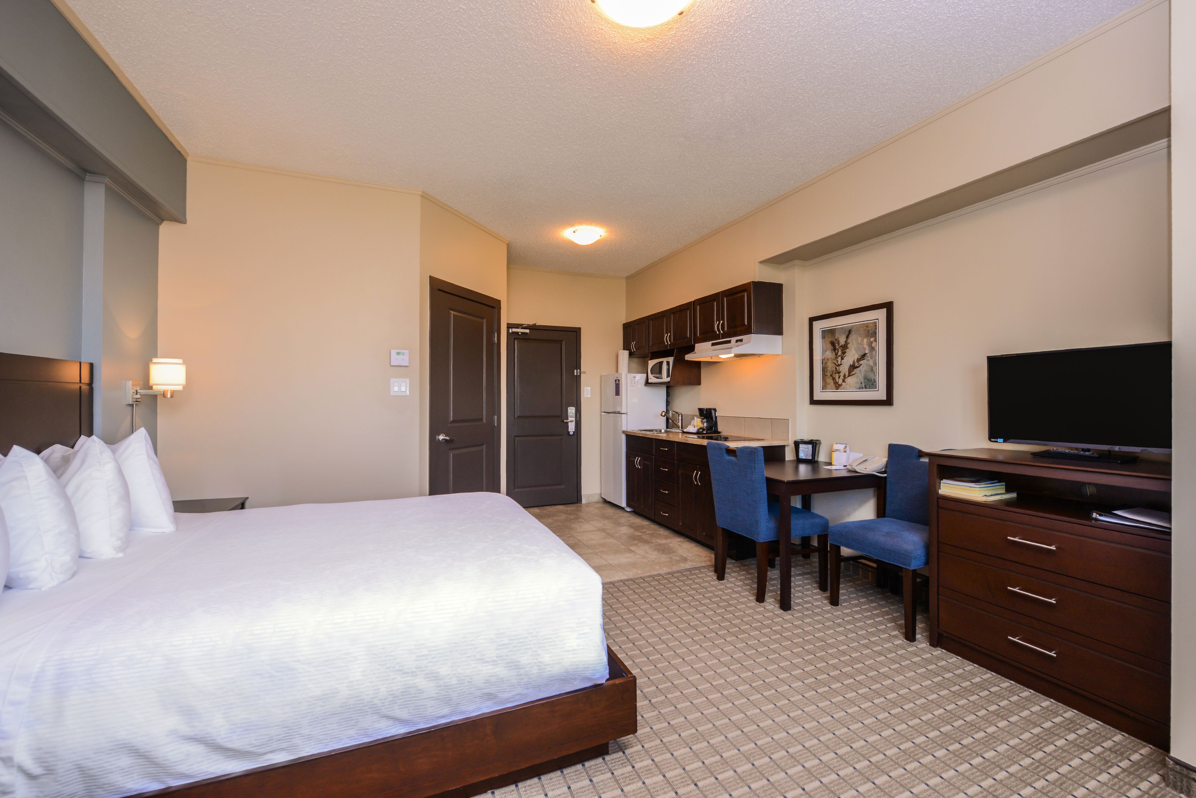 full-sized fridge, microwave, stovetop, coffee/tea maker