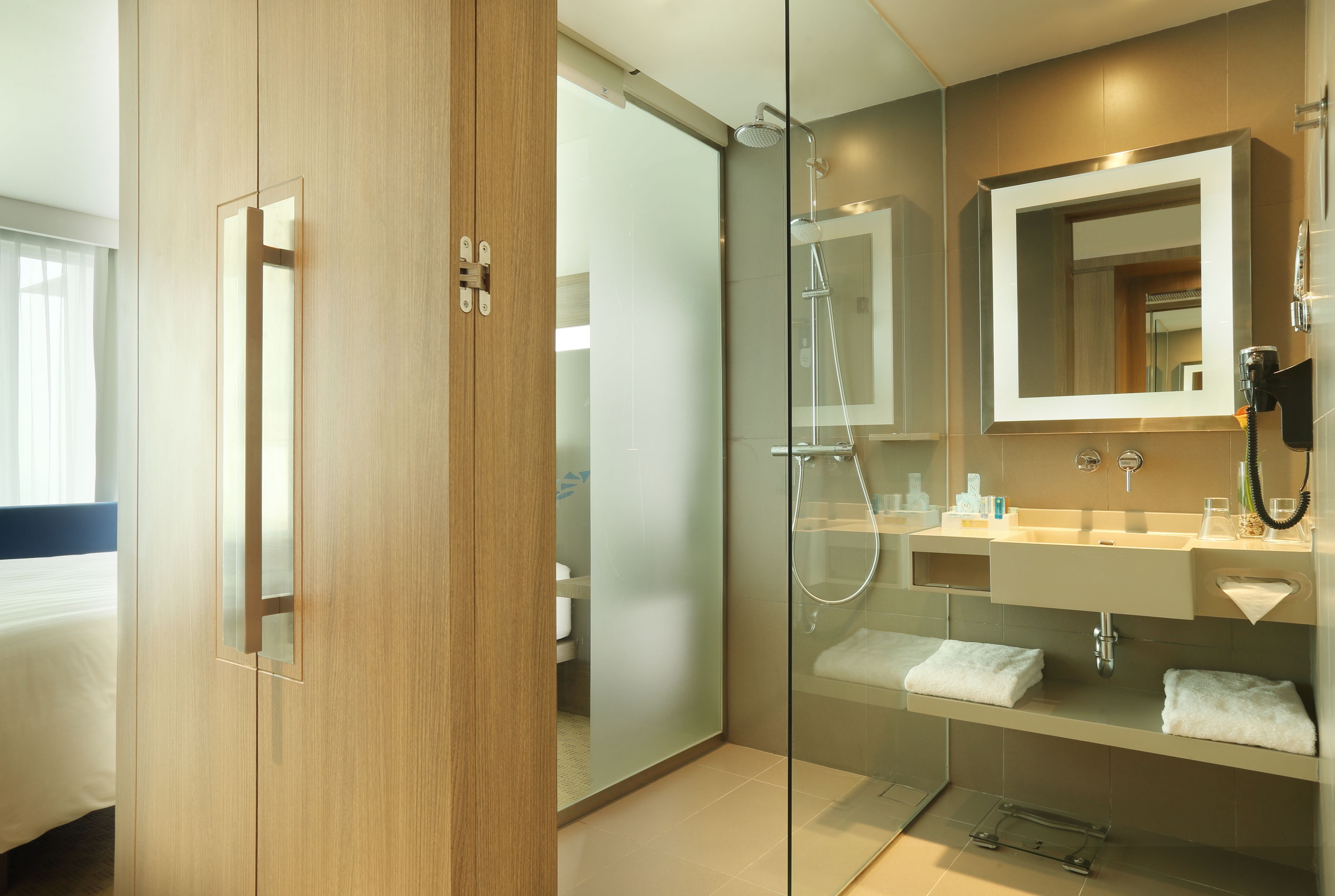 eco-friendly toiletries, hair dryer, slippers, towels