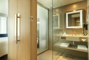 Eco-friendly toiletries, hair dryer, slippers, towels