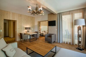 Suite, Sauna | Living area | Flat-screen TV