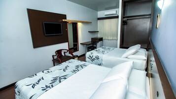 Deluxe Quadruple Room | Minibar, in-room safe, desk, laptop workspace