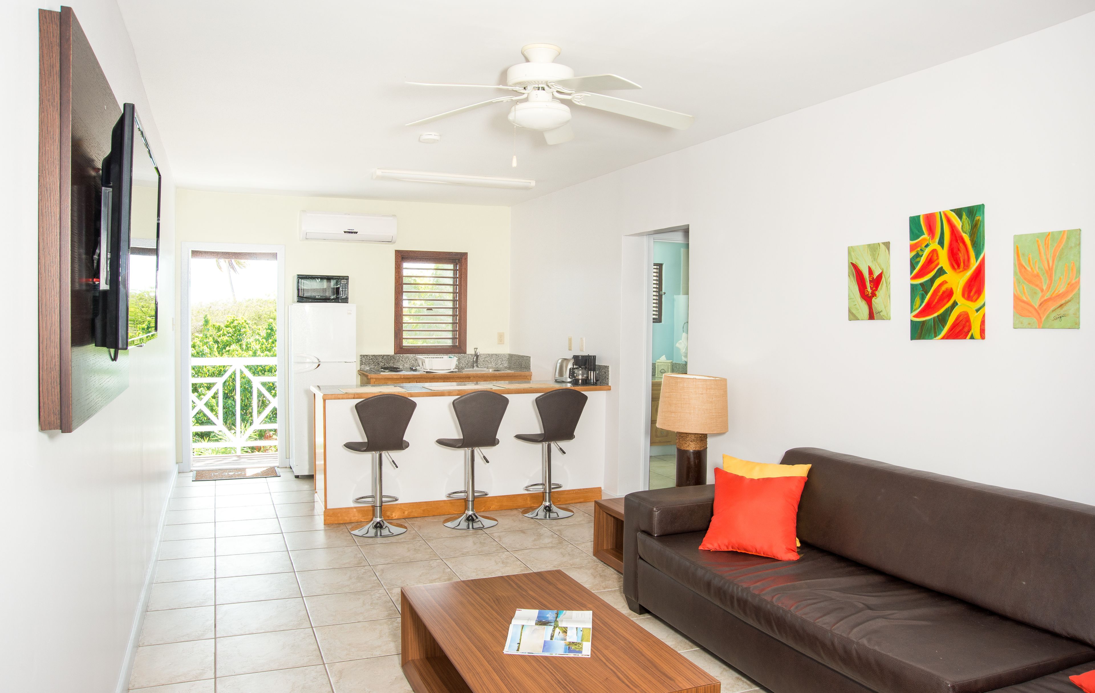 suite, 1 king bed with sofa bed, pool view | private kitchenette | full-sized fridge, microwave, stovetop, coffee/tea maker