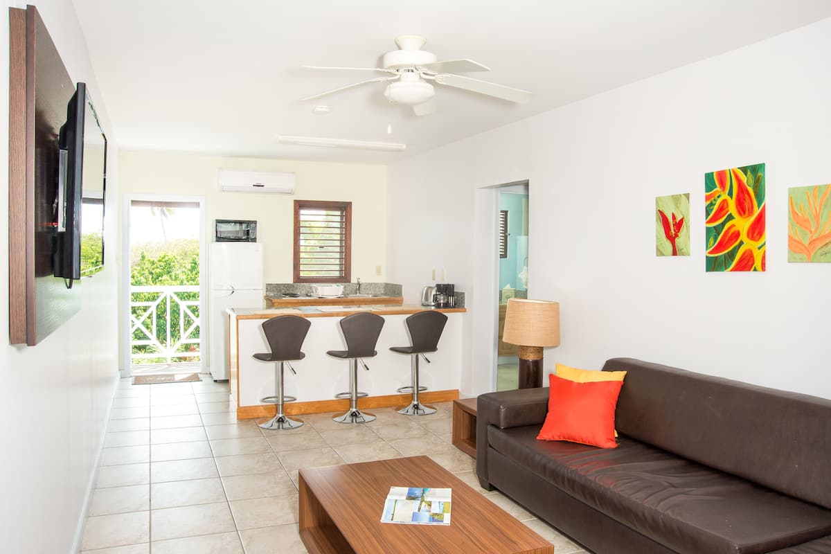 suite, 1 king bed with sofa bed, pool view | private kitchenette | full-sized fridge, microwave, stovetop, coffee/tea maker