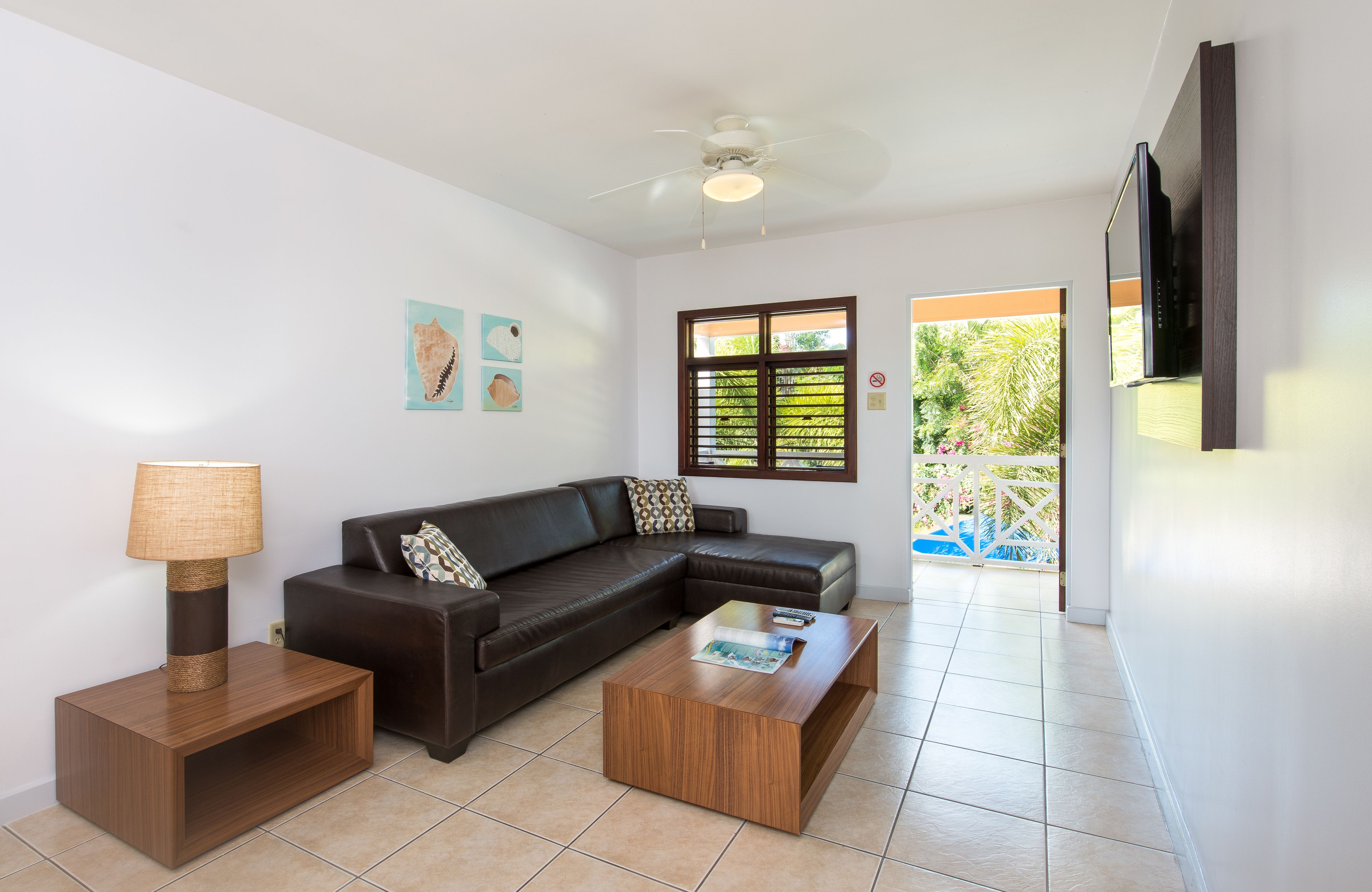 suite, 1 king bed with sofa bed, pool view | living room | flat-screen tv