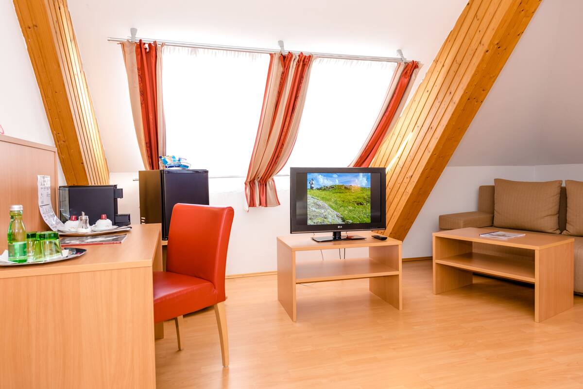 comfort double room | living area | flat-screen tv