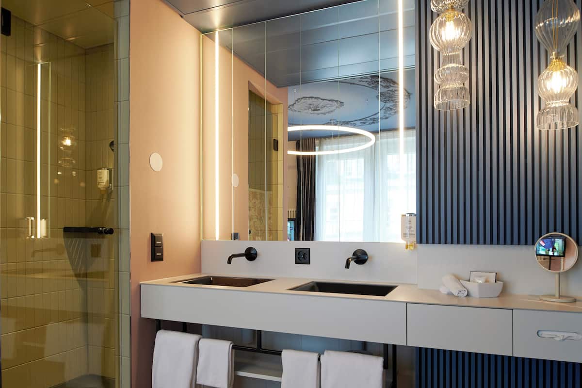 boutique suite with balcony | bathroom | free toiletries, hair dryer, bathrobes, slippers