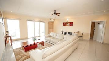 Executive Suite, 2 Bedrooms | Living area | 32-inch flat-screen TV with satellite channels, TV