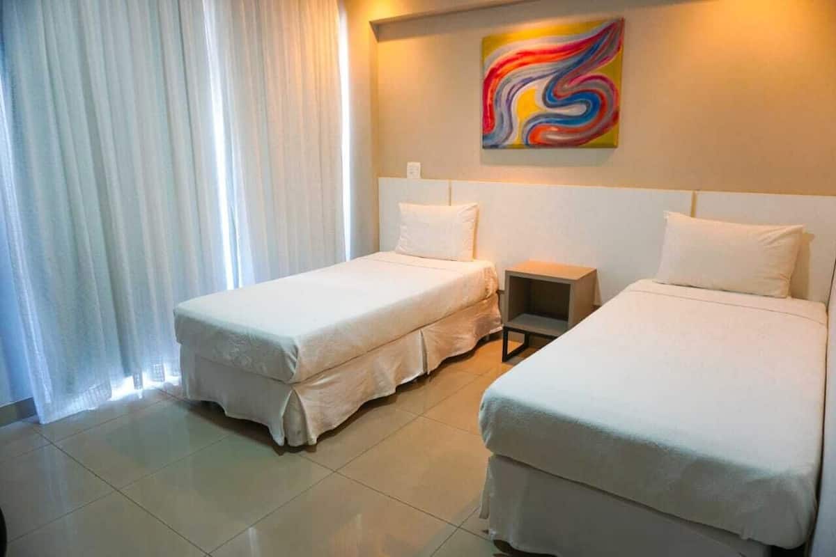 economy single room | minibar, in-room safe, desk, blackout curtains