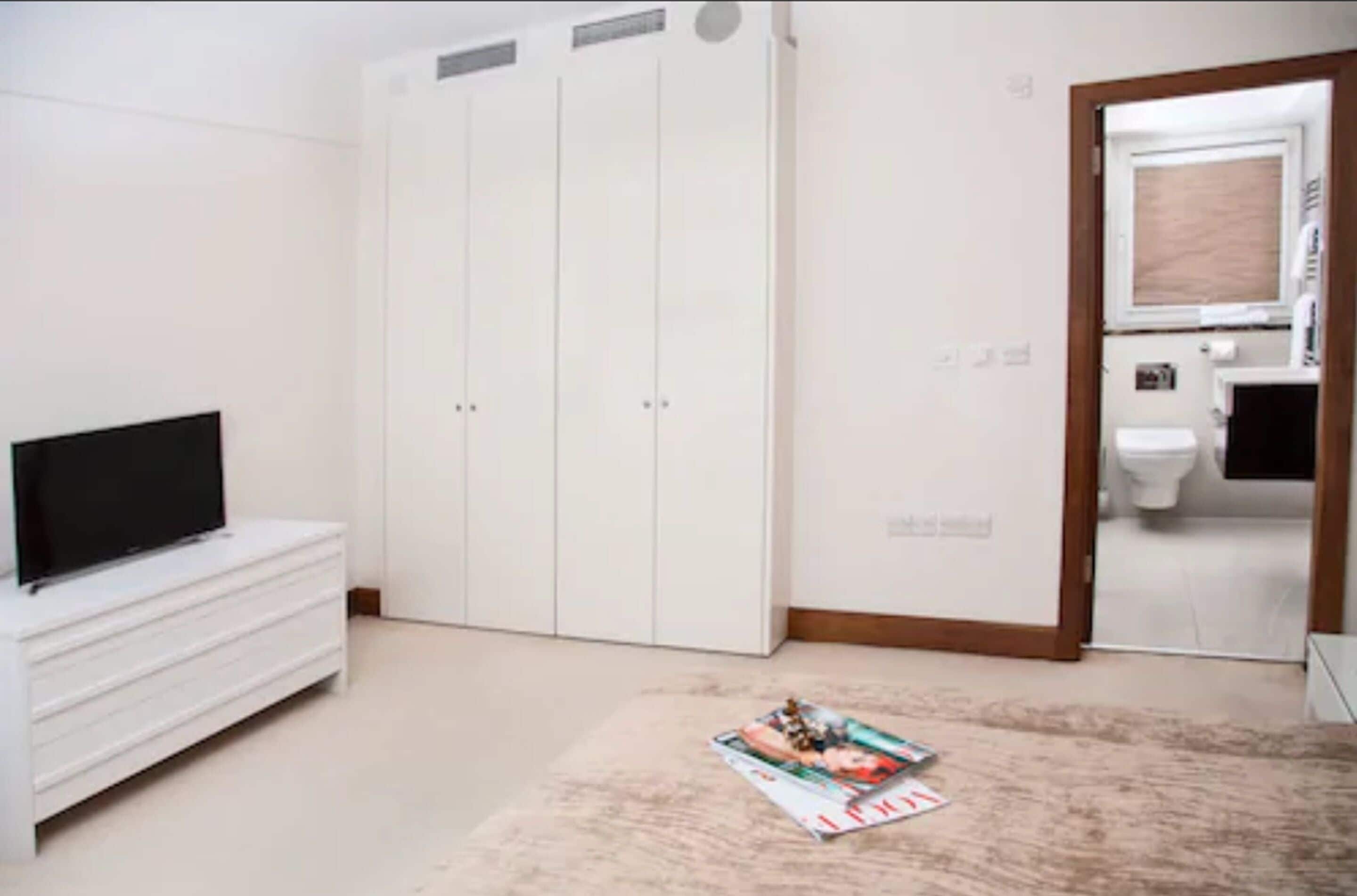 Apartment, 1 Bedroom, Garden View | In-room safe, desk, iron/ironing board, free cots/infant beds