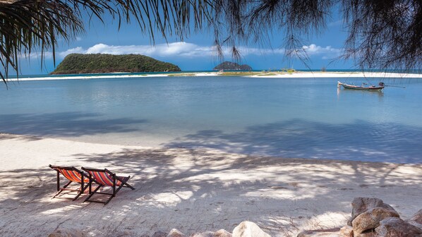 On the beach, beach towels, windsurfing, kayaking