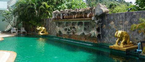 Outdoor pool, pool umbrellas, sun loungers